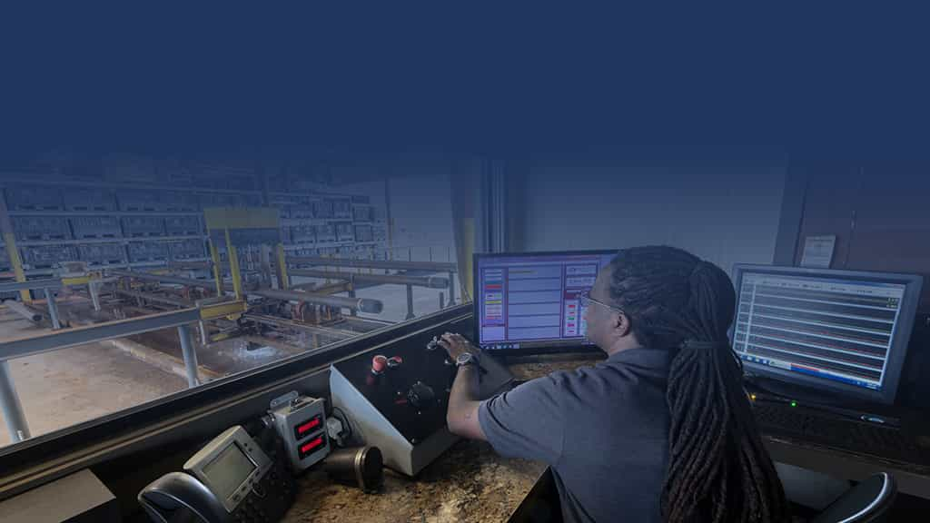 Man in control room of a warehouse